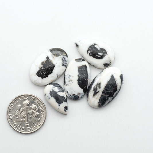 Natural White Buffalo Stone Cabochons are semi-precious gemstones cut into shapes ideal for jewelry-making, making them an excellent choice for artisans.
