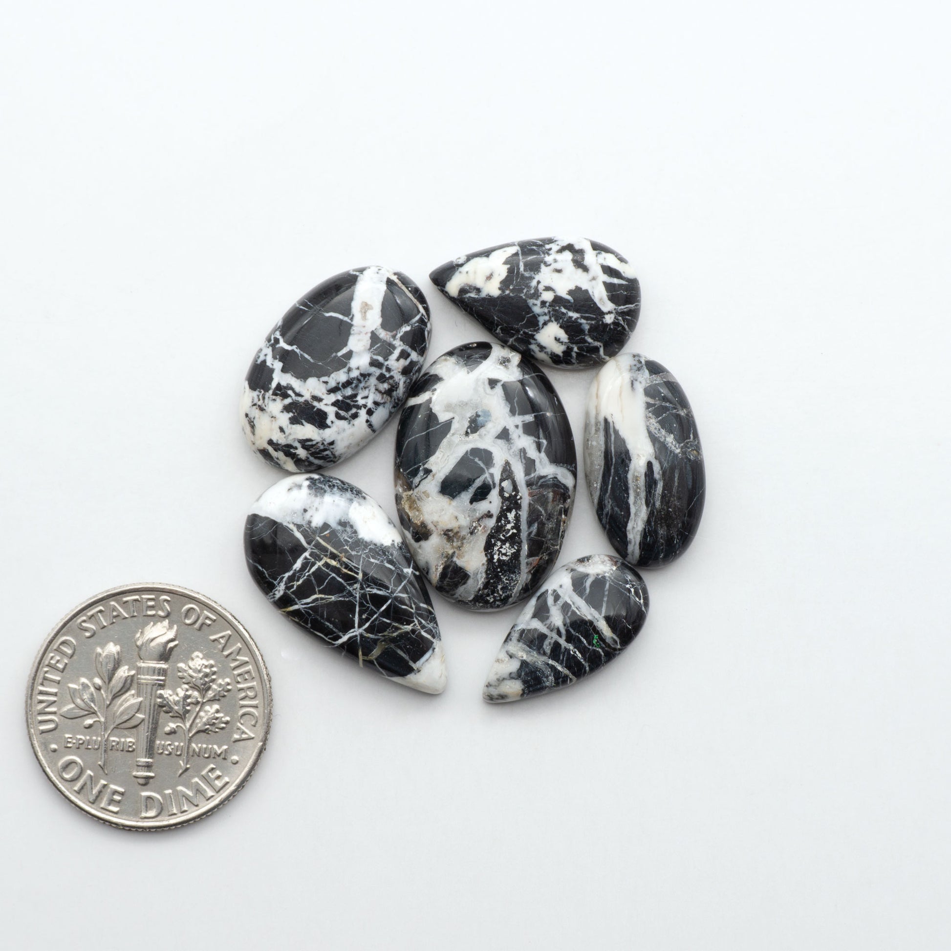 Natural White Buffalo Stone Cabochons are semi-precious gemstones cut into shapes ideal for jewelry-making, making them an excellent choice for artisans.
