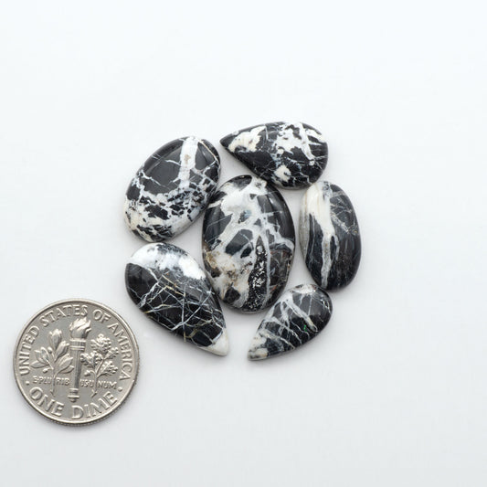 Natural White Buffalo Stone Cabochons are semi-precious gemstones cut into shapes ideal for jewelry-making, making them an excellent choice for artisans.
