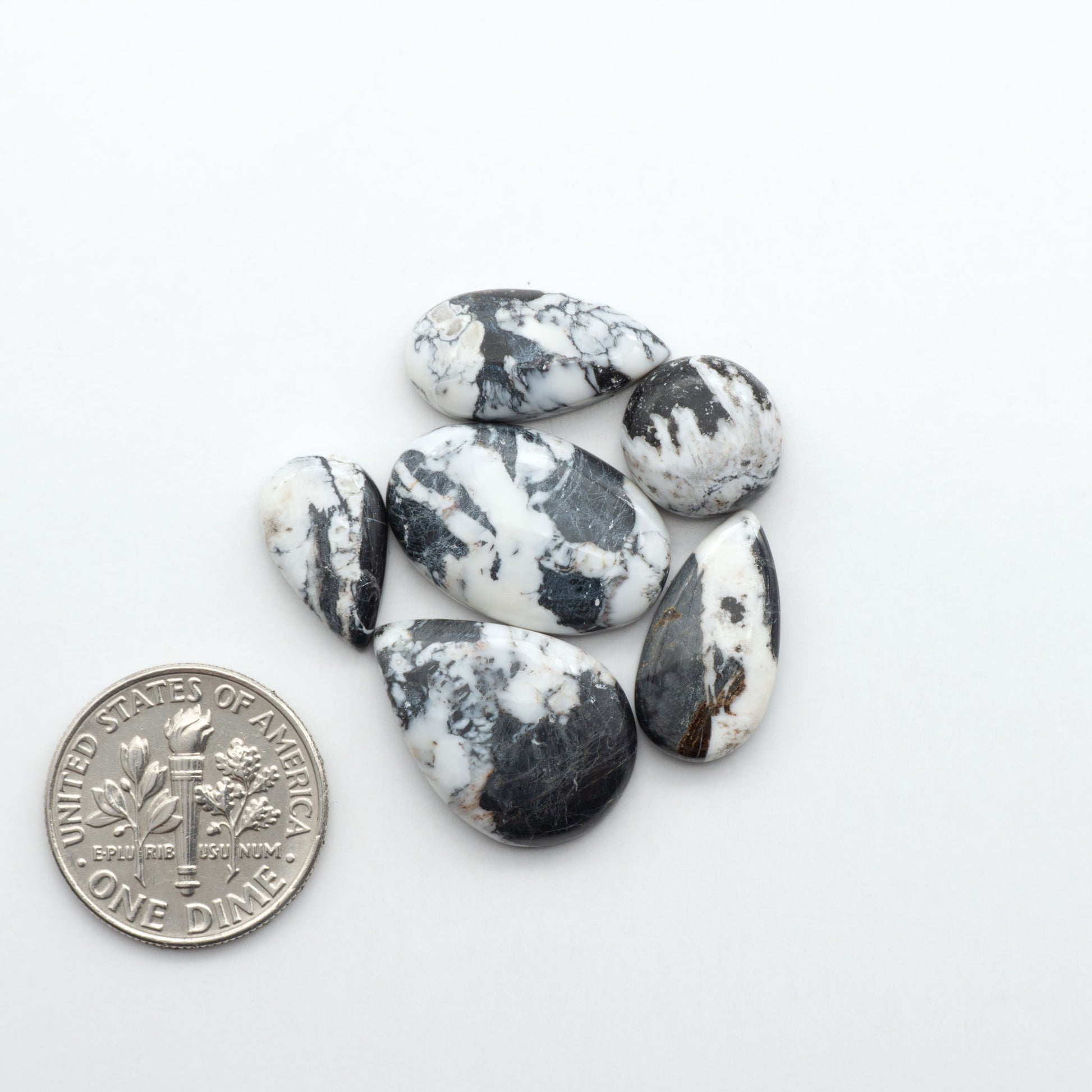 Natural White Buffalo Stone Cabochons are semi-precious gemstones cut into shapes ideal for jewelry-making, making them an excellent choice for artisans.
