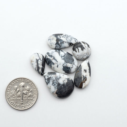 Natural White Buffalo Stone Cabochons are semi-precious gemstones cut into shapes ideal for jewelry-making, making them an excellent choice for artisans.
