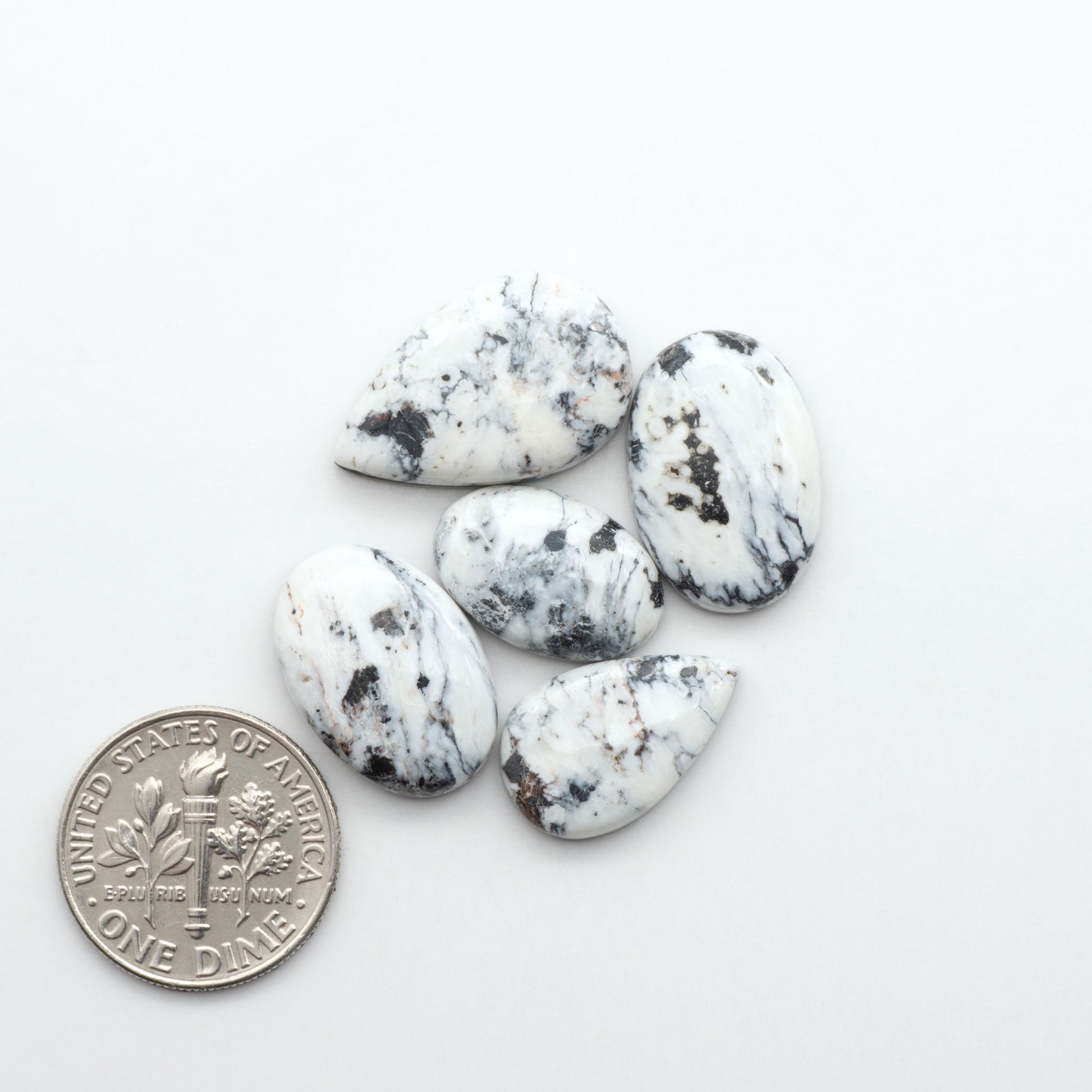 Natural White Buffalo Stone Cabochons are semi-precious gemstones cut into shapes ideal for jewelry-making, making them an excellent choice for artisans.
