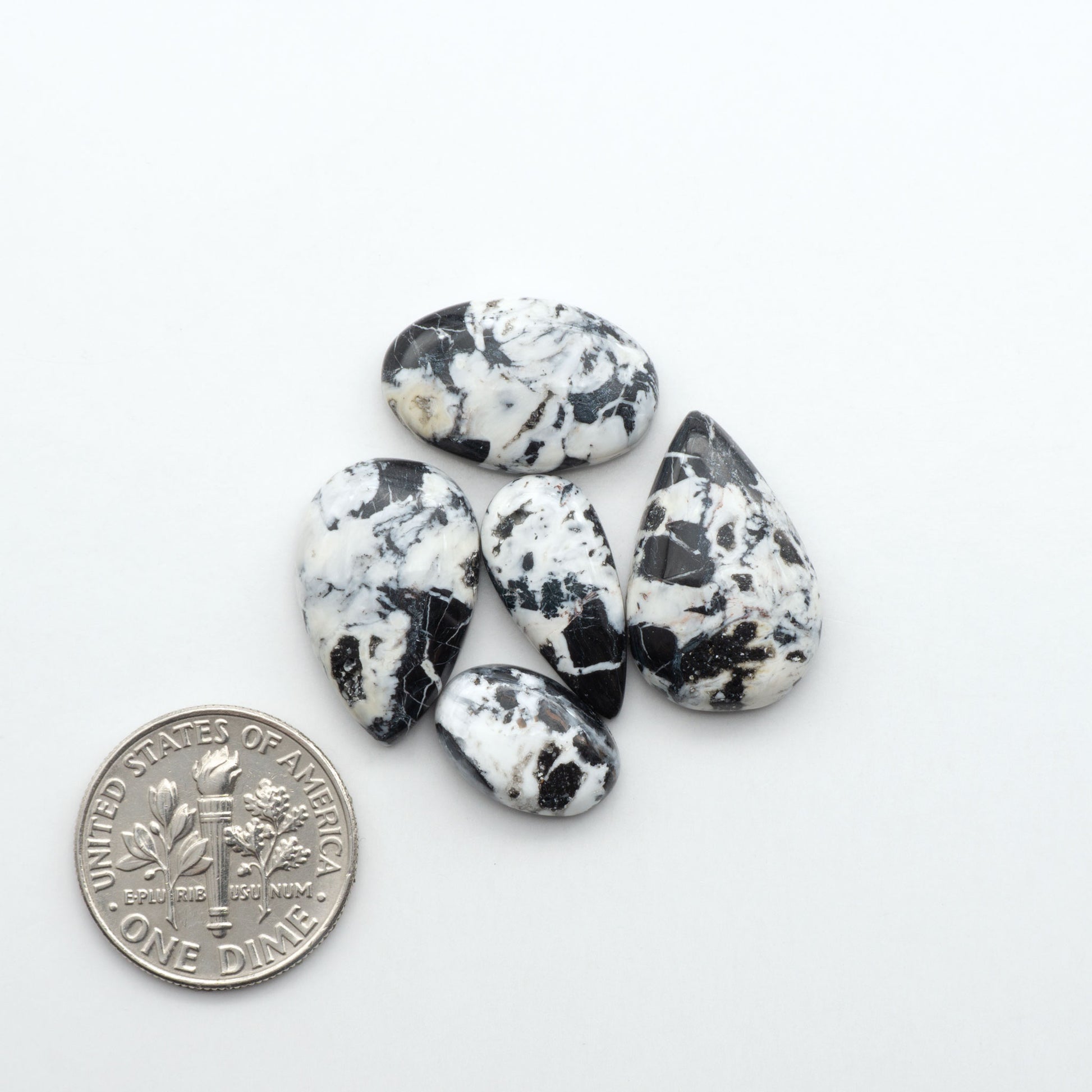 Natural White Buffalo Stone Cabochons are semi-precious gemstones cut into shapes ideal for jewelry-making, making them an excellent choice for artisans.
