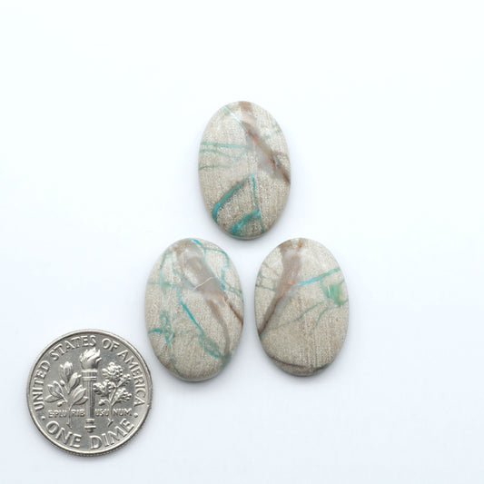 Carico Lake Turquoise cabochons with vibrant aqua-blue to turquoise tones and natural matrix, ideal for rings, pendants, and artisan jewelry.