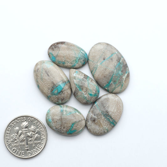 Carico Lake Turquoise cabochons with vibrant aqua-blue to turquoise tones and natural matrix, ideal for rings, pendants, and artisan jewelry.