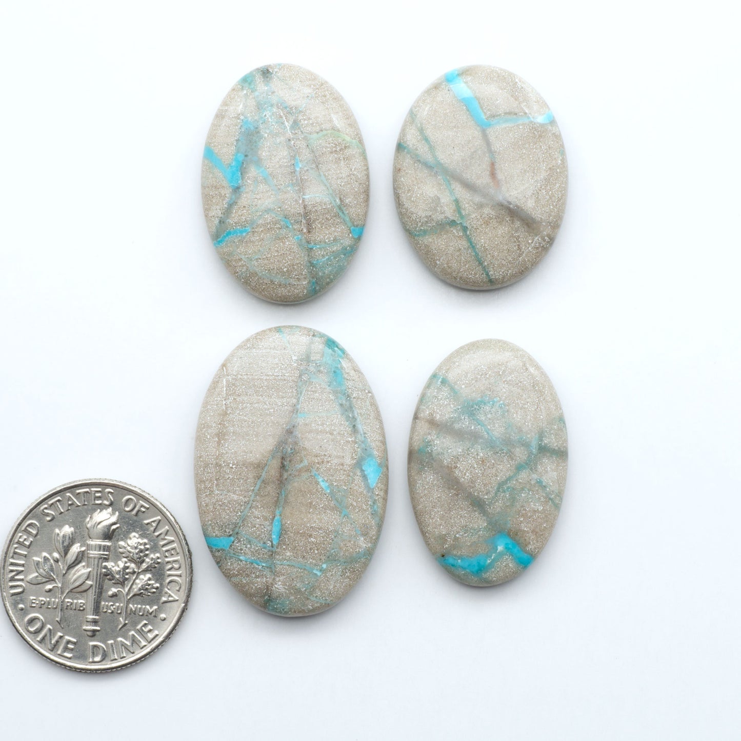 Carico Lake Turquoise cabochons with vibrant aqua-blue to turquoise tones and natural matrix, ideal for rings, pendants, and artisan jewelry.