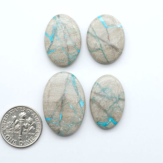Carico Lake Turquoise cabochons with vibrant aqua-blue to turquoise tones and natural matrix, ideal for rings, pendants, and artisan jewelry.