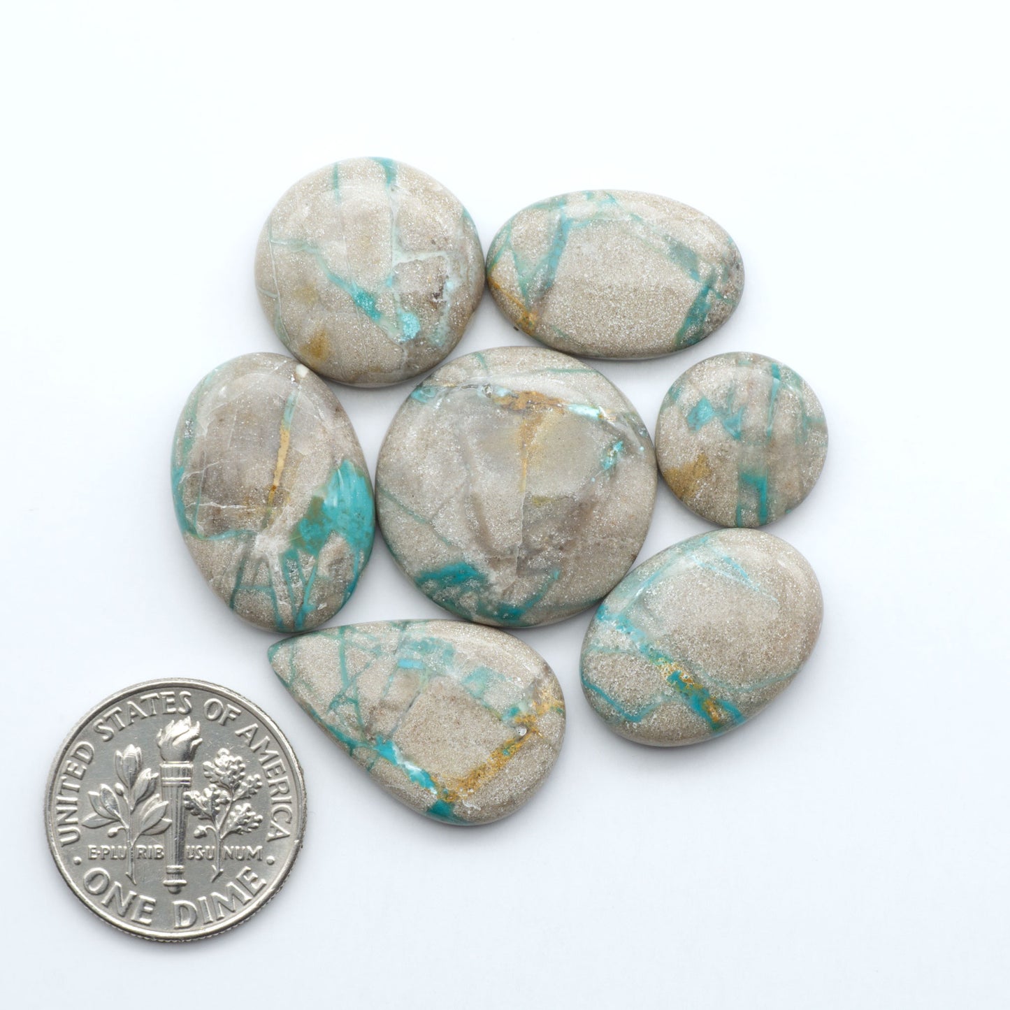 Carico Lake Turquoise cabochons with vibrant aqua-blue to turquoise tones and natural matrix, ideal for rings, pendants, and artisan jewelry.