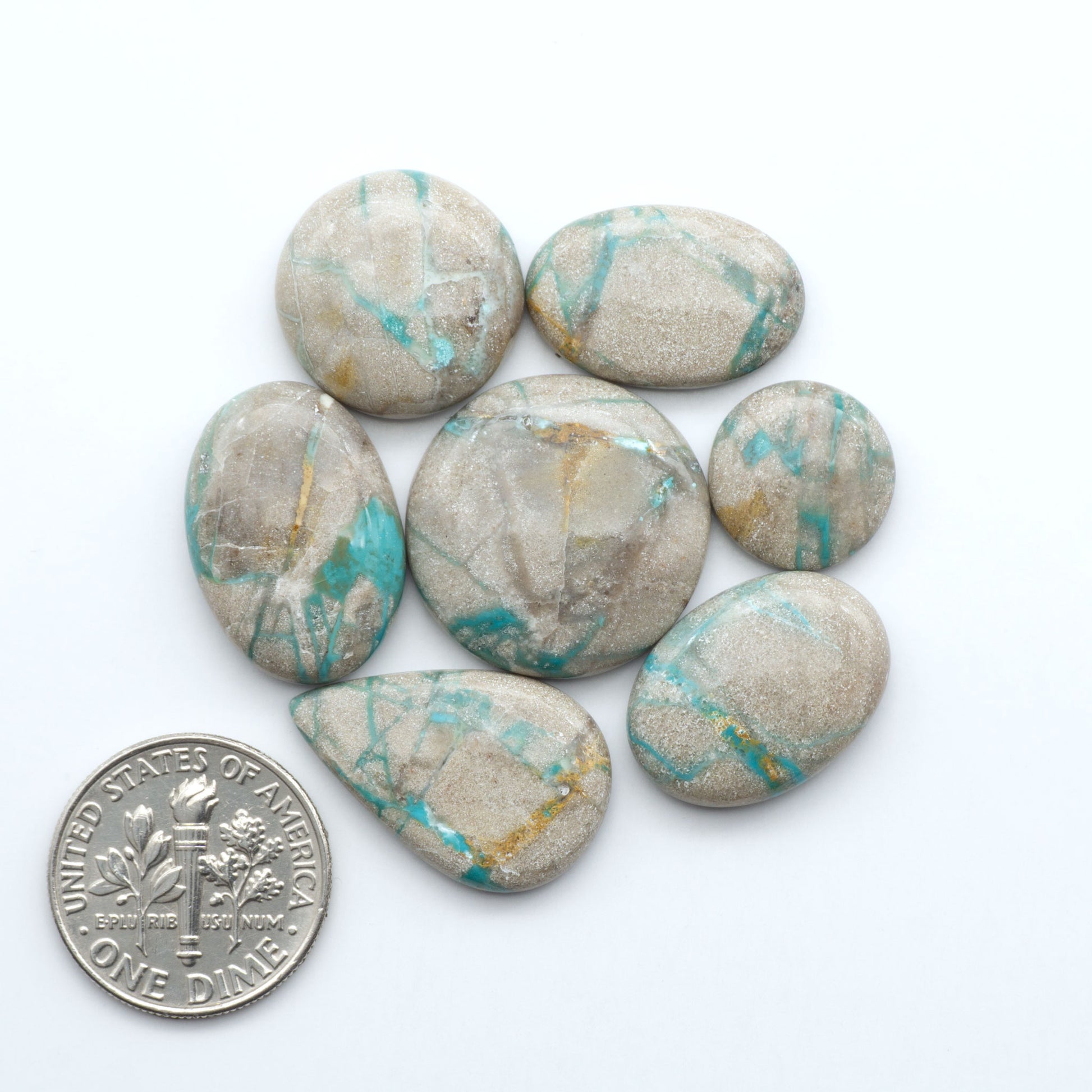 Carico Lake Turquoise cabochons with vibrant aqua-blue to turquoise tones and natural matrix, ideal for rings, pendants, and artisan jewelry.