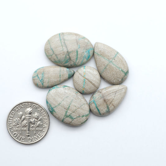 Carico Lake Turquoise cabochons with vibrant aqua-blue to turquoise tones and natural matrix, ideal for rings, pendants, and artisan jewelry.