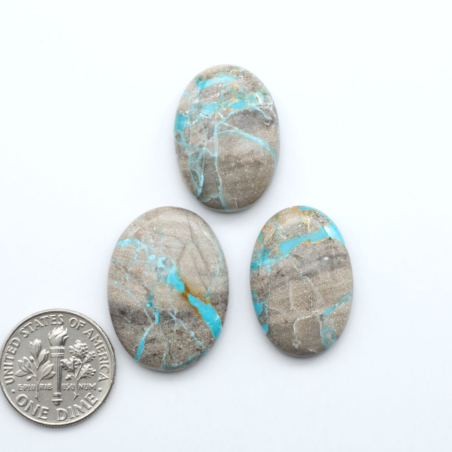 Carico Lake Turquoise cabochons with vibrant aqua-blue to turquoise tones and natural matrix, ideal for rings, pendants, and artisan jewelry.