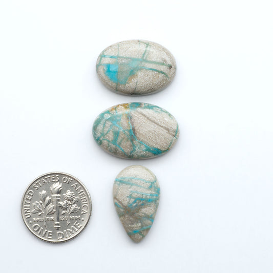 Carico Lake Turquoise cabochons with vibrant aqua-blue to turquoise tones and natural matrix, ideal for rings, pendants, and artisan jewelry.
