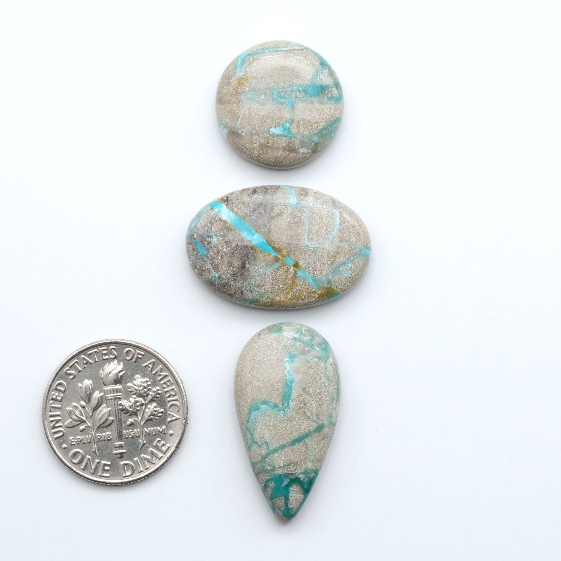 Carico Lake Turquoise cabochons with vibrant aqua-blue to turquoise tones and natural matrix, ideal for rings, pendants, and artisan jewelry.
