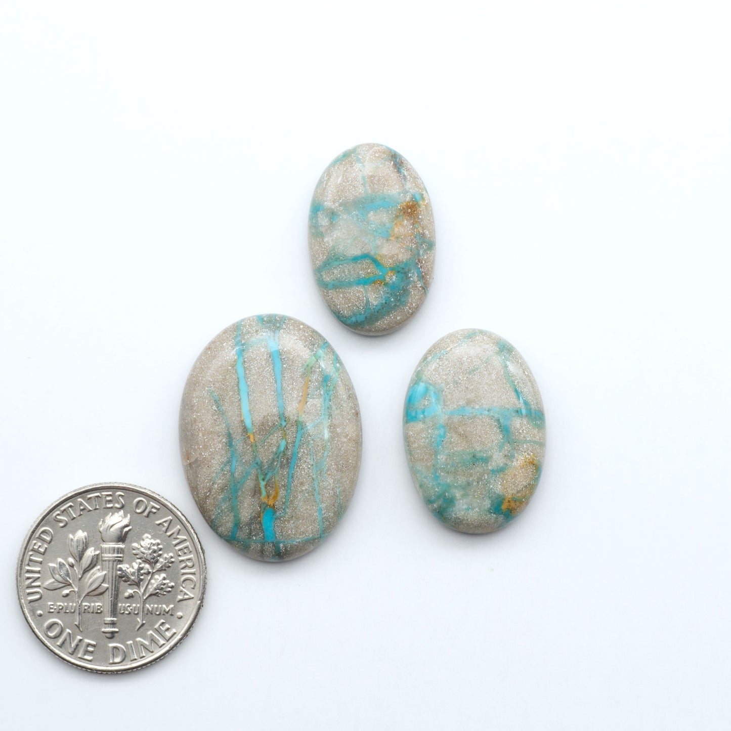 Carico Lake Turquoise cabochons with vibrant aqua-blue to turquoise tones and natural matrix, ideal for rings, pendants, and artisan jewelry.