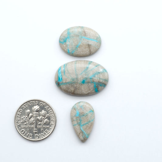 Carico Lake Turquoise cabochons with vibrant aqua-blue to turquoise tones and natural matrix, ideal for rings, pendants, and artisan jewelry.