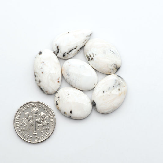 Natural White Buffalo Stone Cabochons are semi-precious gemstones cut into shapes ideal for jewelry-making, making them an excellent choice for artisans.