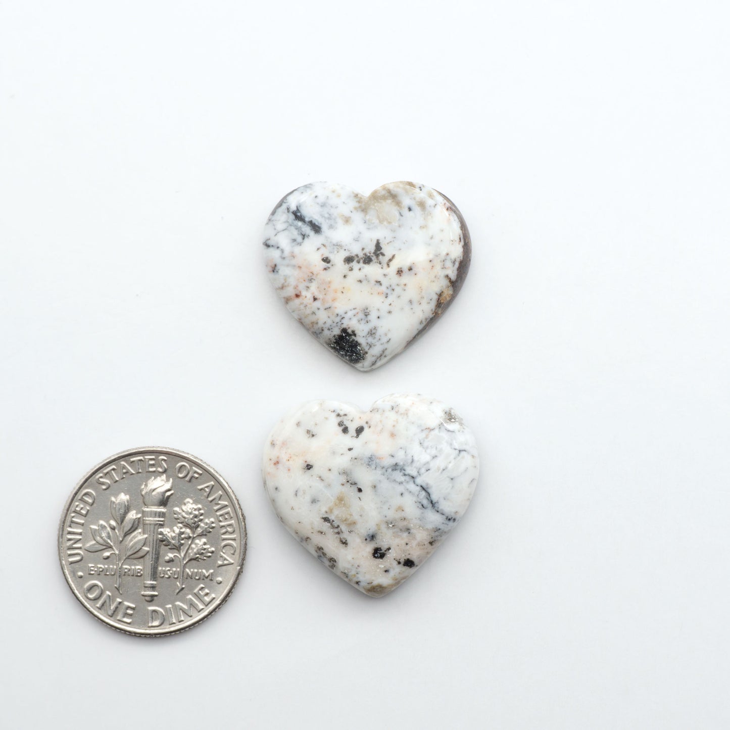 Natural White Buffalo Stone Cabochons are semi-precious gemstones cut into shapes ideal for jewelry-making, making them an excellent choice for artisans.