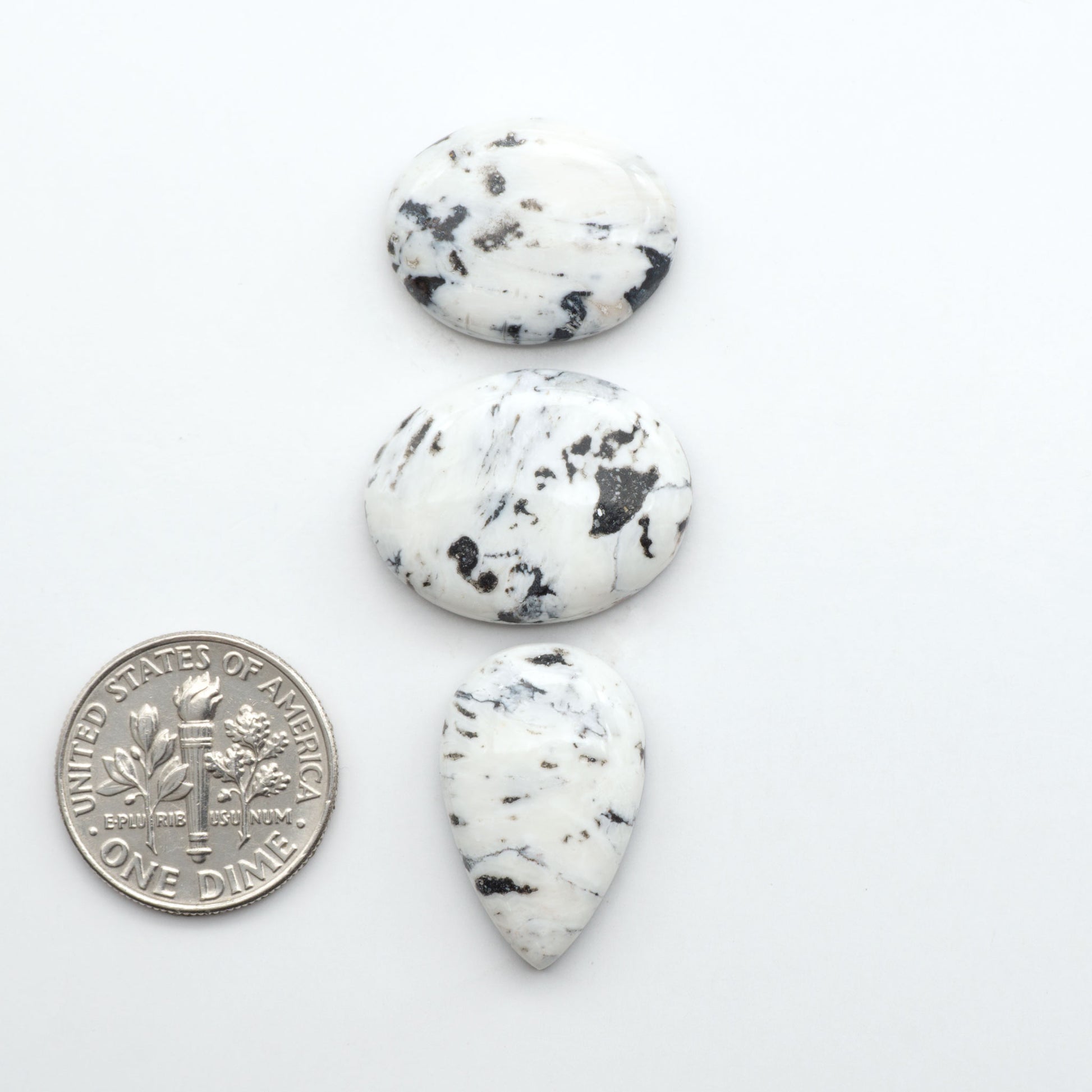 Natural White Buffalo Stone Cabochons are semi-precious gemstones cut into shapes ideal for jewelry-making, making them an excellent choice for artisans.