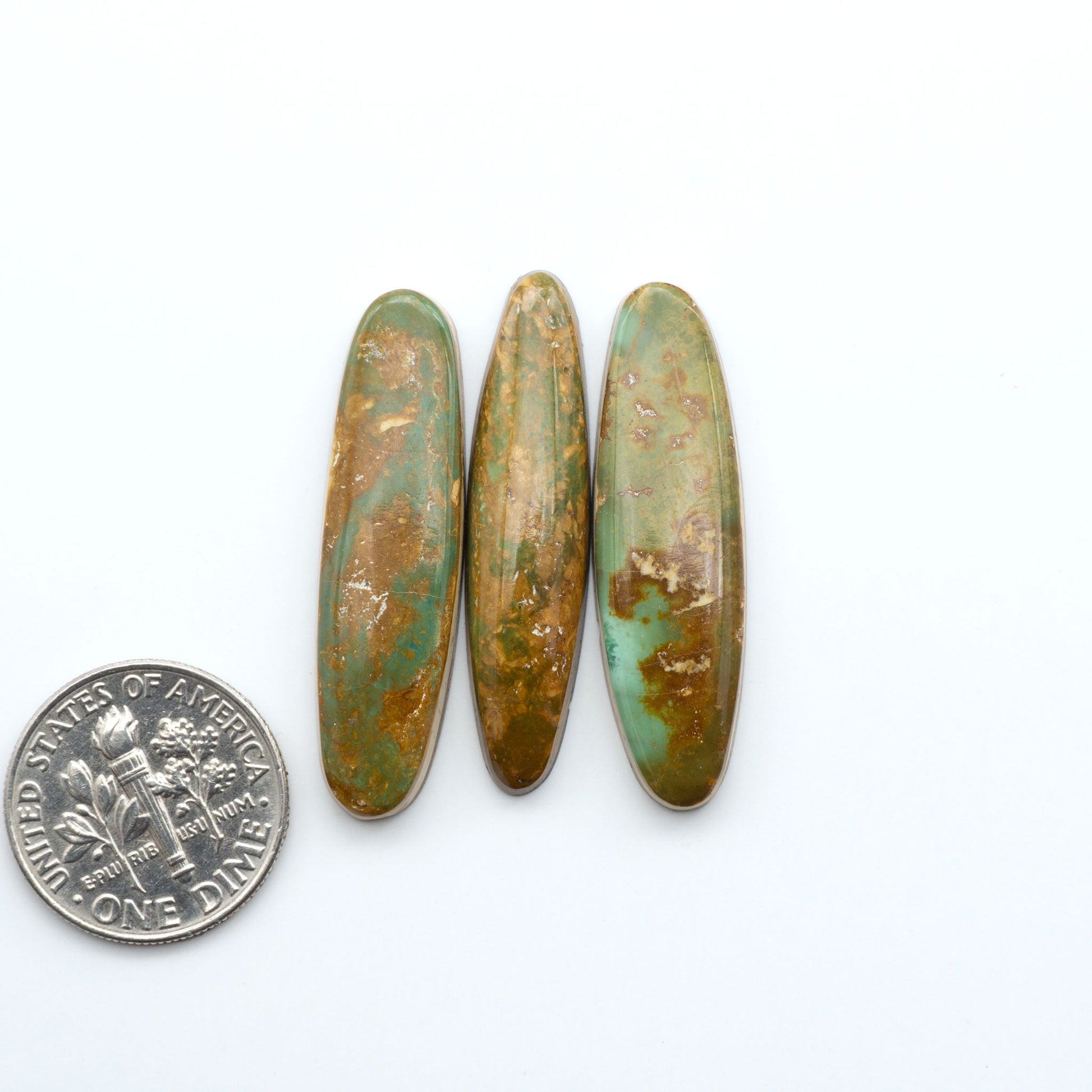 Hand-cut Natural Cerrillos Turquoise cabochons with rare blue-green hues and historic New Mexico origins—perfect for artisan jewelry.