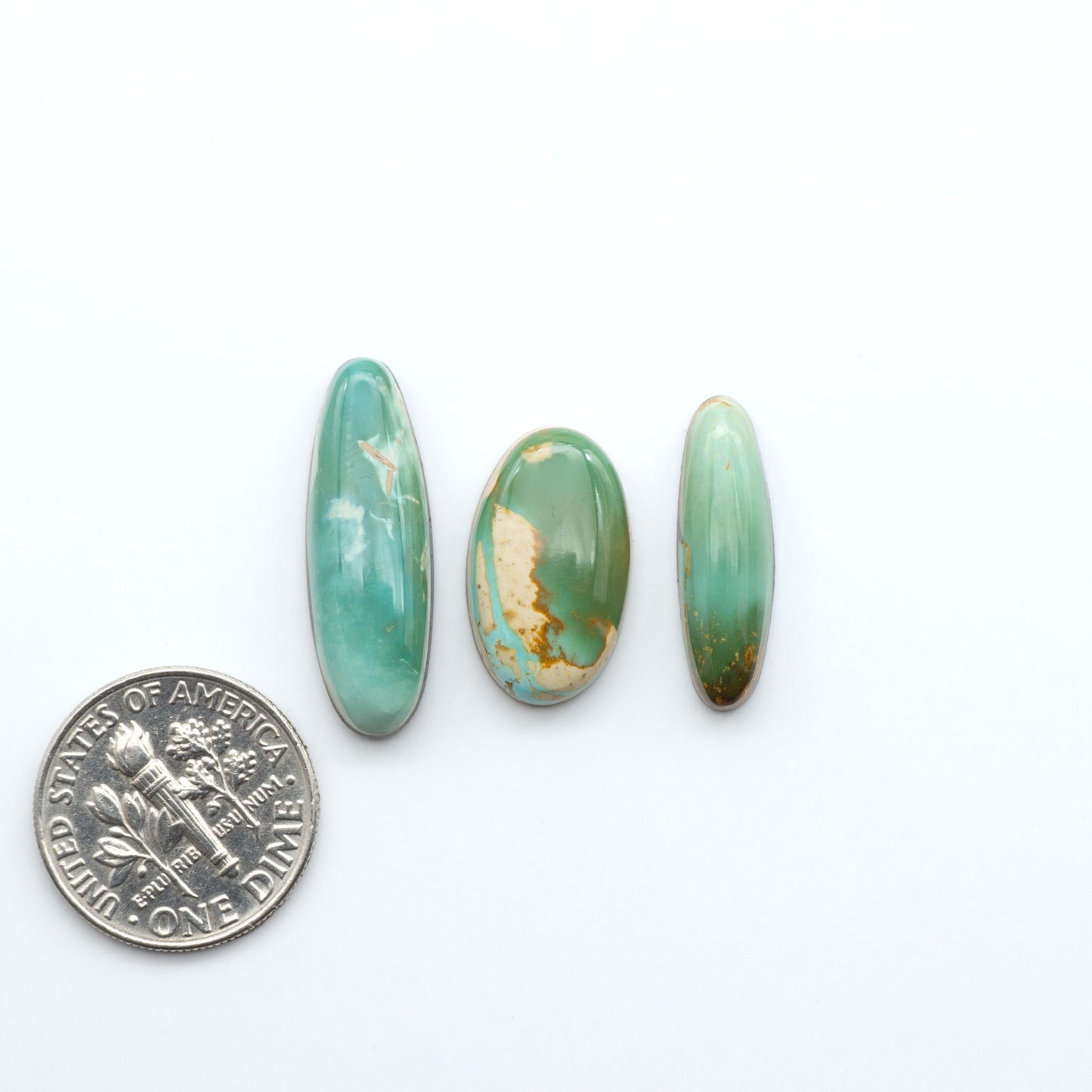 Hand-cut Natural Cerrillos Turquoise cabochons with rare blue-green hues and historic New Mexico origins—perfect for artisan jewelry.
