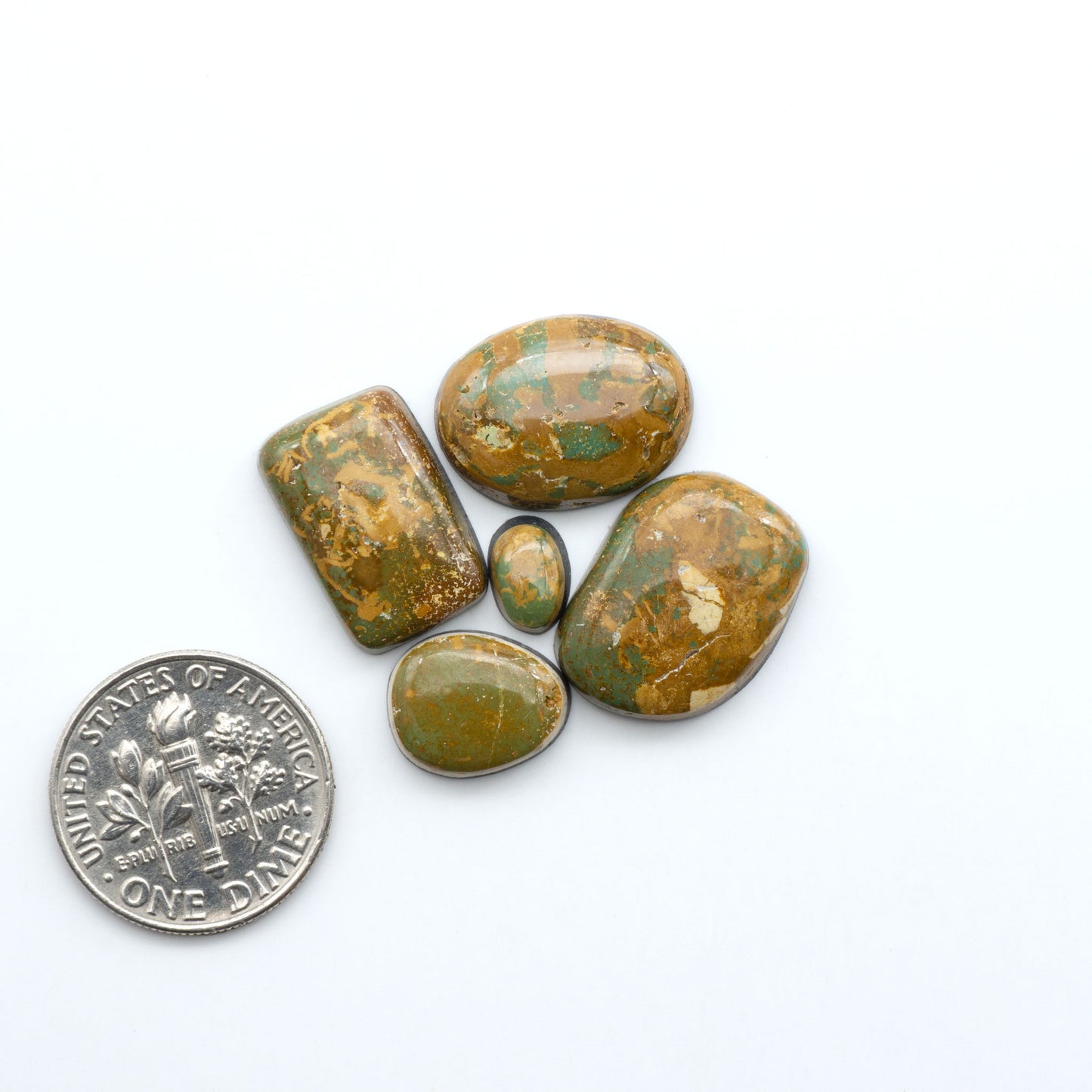 Hand-cut Natural Cerrillos Turquoise cabochons with rare blue-green hues and historic New Mexico origins—perfect for artisan jewelry.