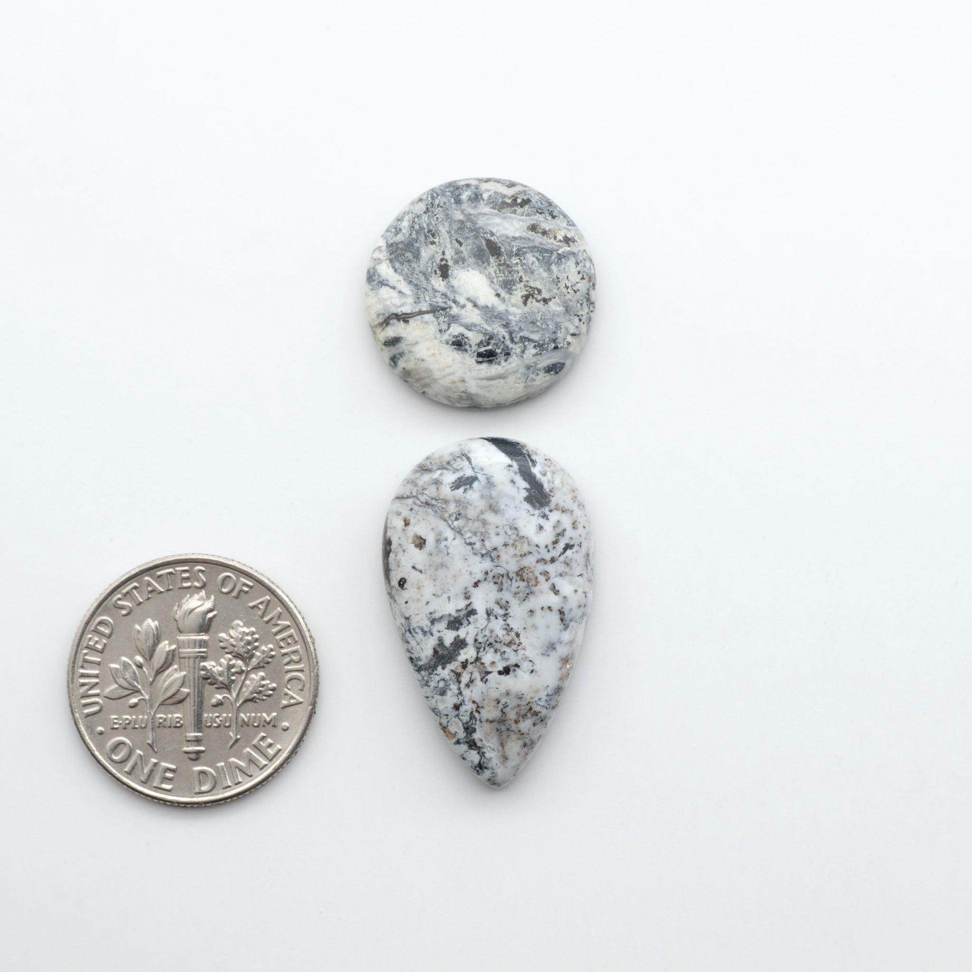 Natural White Buffalo Stone Cabochons are semi-precious gemstones cut into shapes ideal for jewelry-making, making them an excellent choice for artisans.