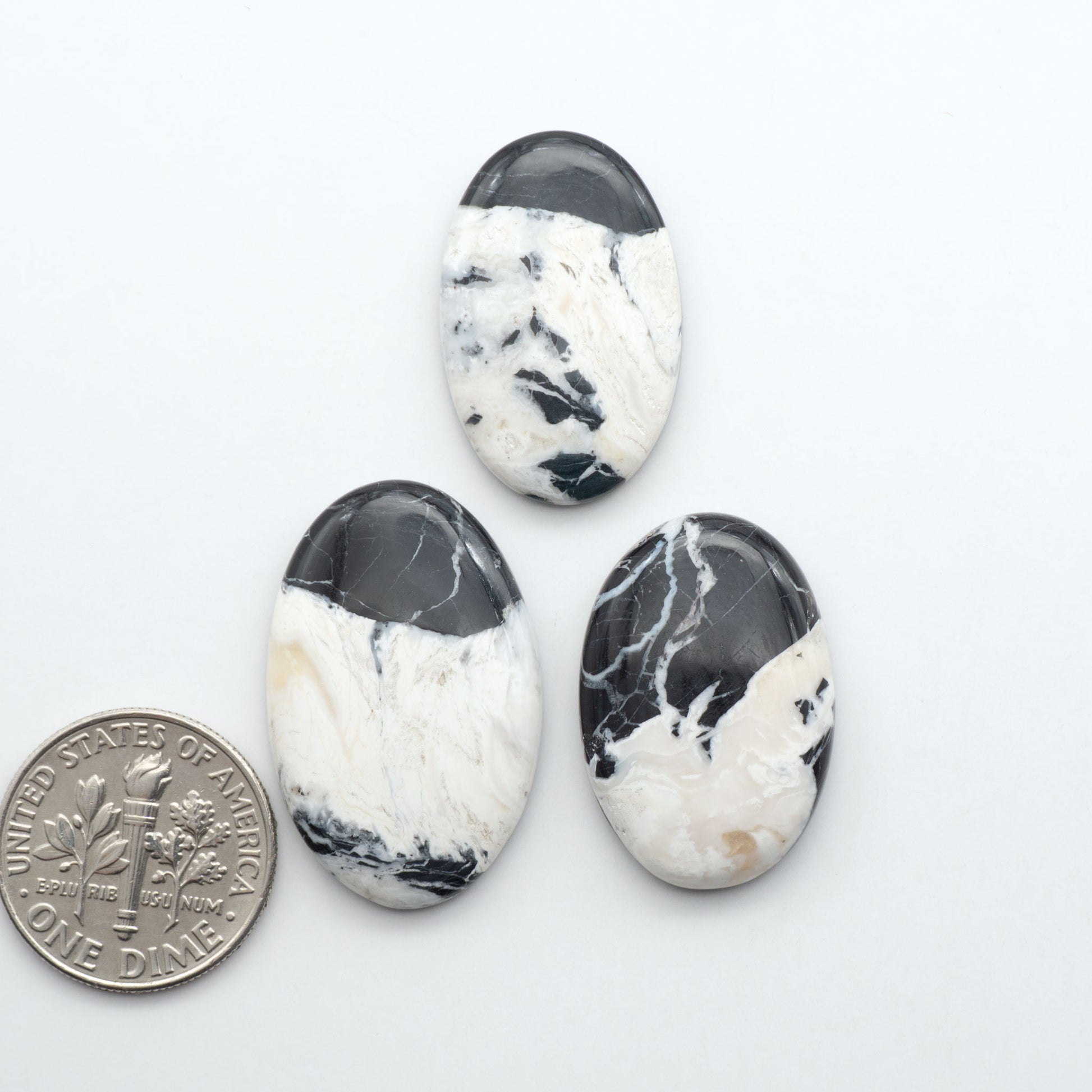 Natural White Buffalo Stone Cabochons are semi-precious gemstones cut into shapes ideal for jewelry-making, making them an excellent choice for artisans.