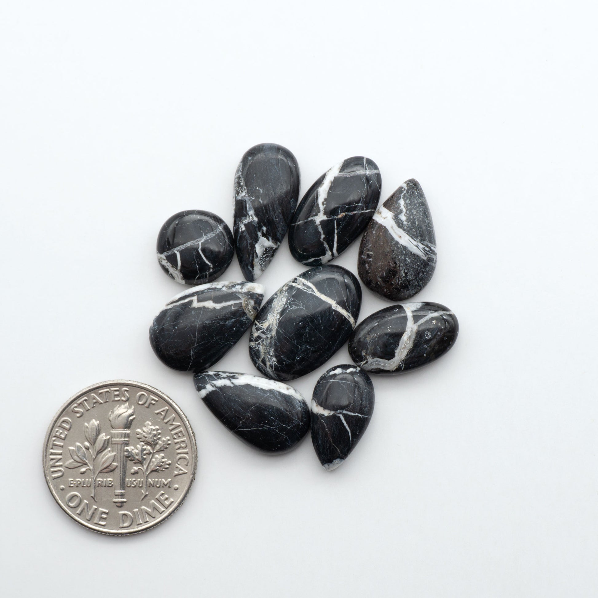 Natural White Buffalo Stone Cabochons are semi-precious gemstones cut into shapes ideal for jewelry-making, making them an excellent choice for artisans.