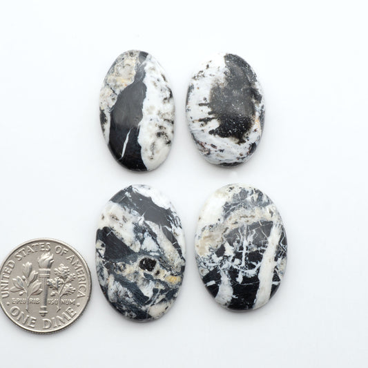 Natural White Buffalo Stone Cabochons are semi-precious gemstones cut into shapes ideal for jewelry-making, making them an excellent choice for artisans.
