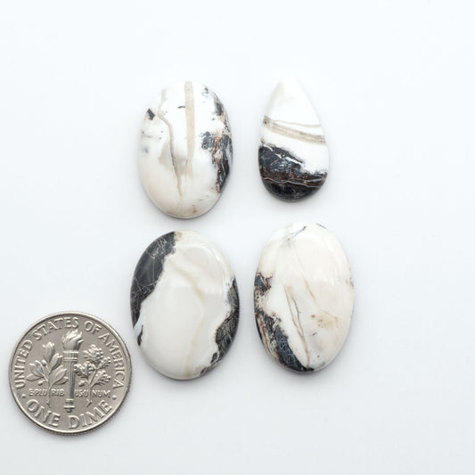 Natural White Buffalo Stone Cabochons are semi-precious gemstones cut into shapes ideal for jewelry-making, making them an excellent choice for artisans.