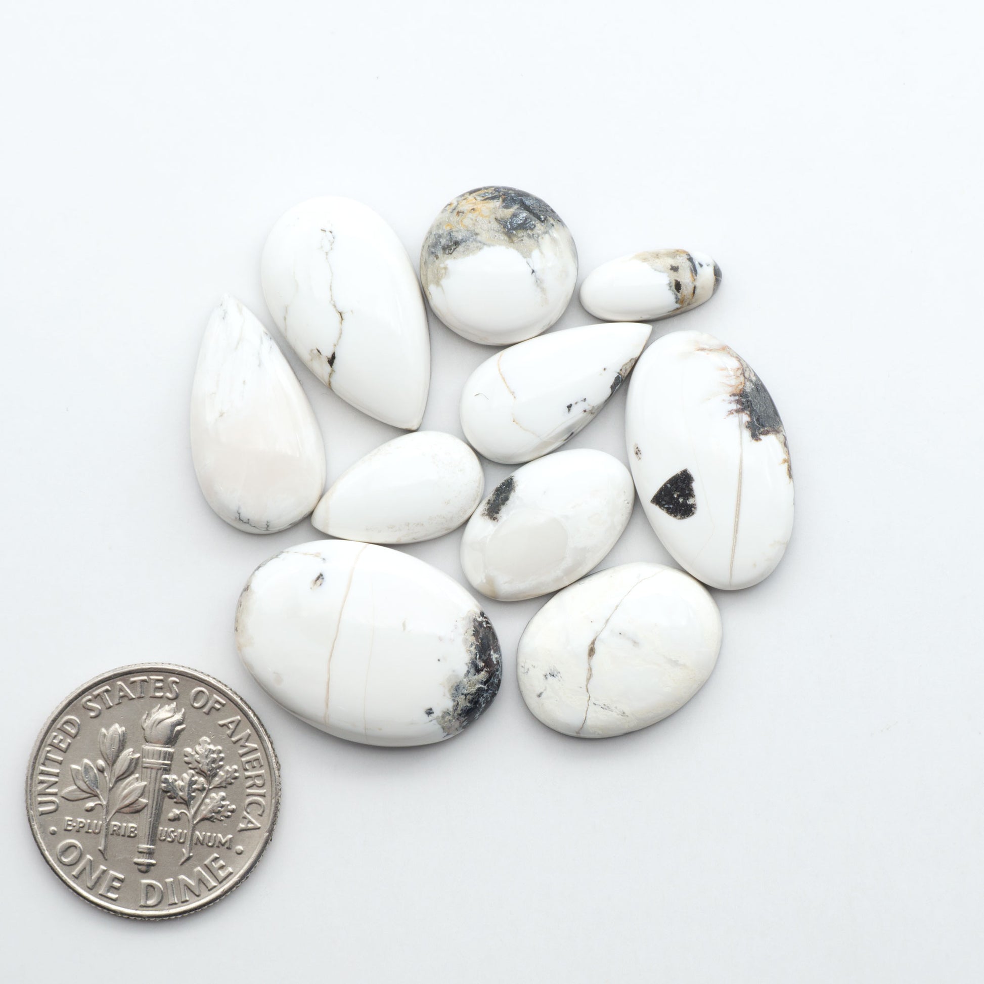 Natural White Buffalo Stone Cabochons are semi-precious gemstones cut into shapes ideal for jewelry-making, making them an excellent choice for artisans.