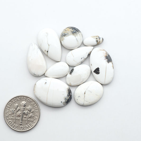 Natural White Buffalo Stone Cabochons are semi-precious gemstones cut into shapes ideal for jewelry-making, making them an excellent choice for artisans.