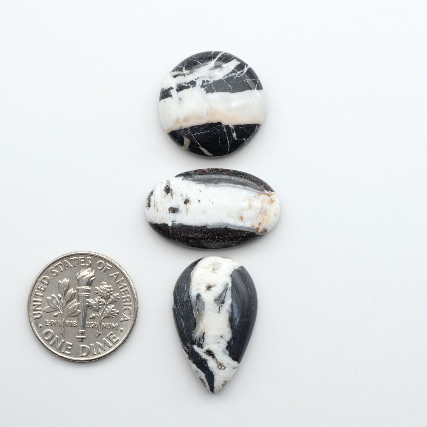 Natural White Buffalo Stone Cabochons are semi-precious gemstones cut into shapes ideal for jewelry-making, making them an excellent choice for artisans.