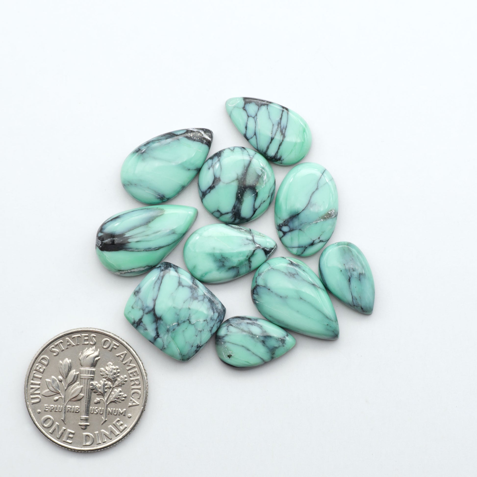 Shop Variscite cabochons with natural matrix patterns, ideal for silversmiths and jewelry makers creating custom rings and pendants.
