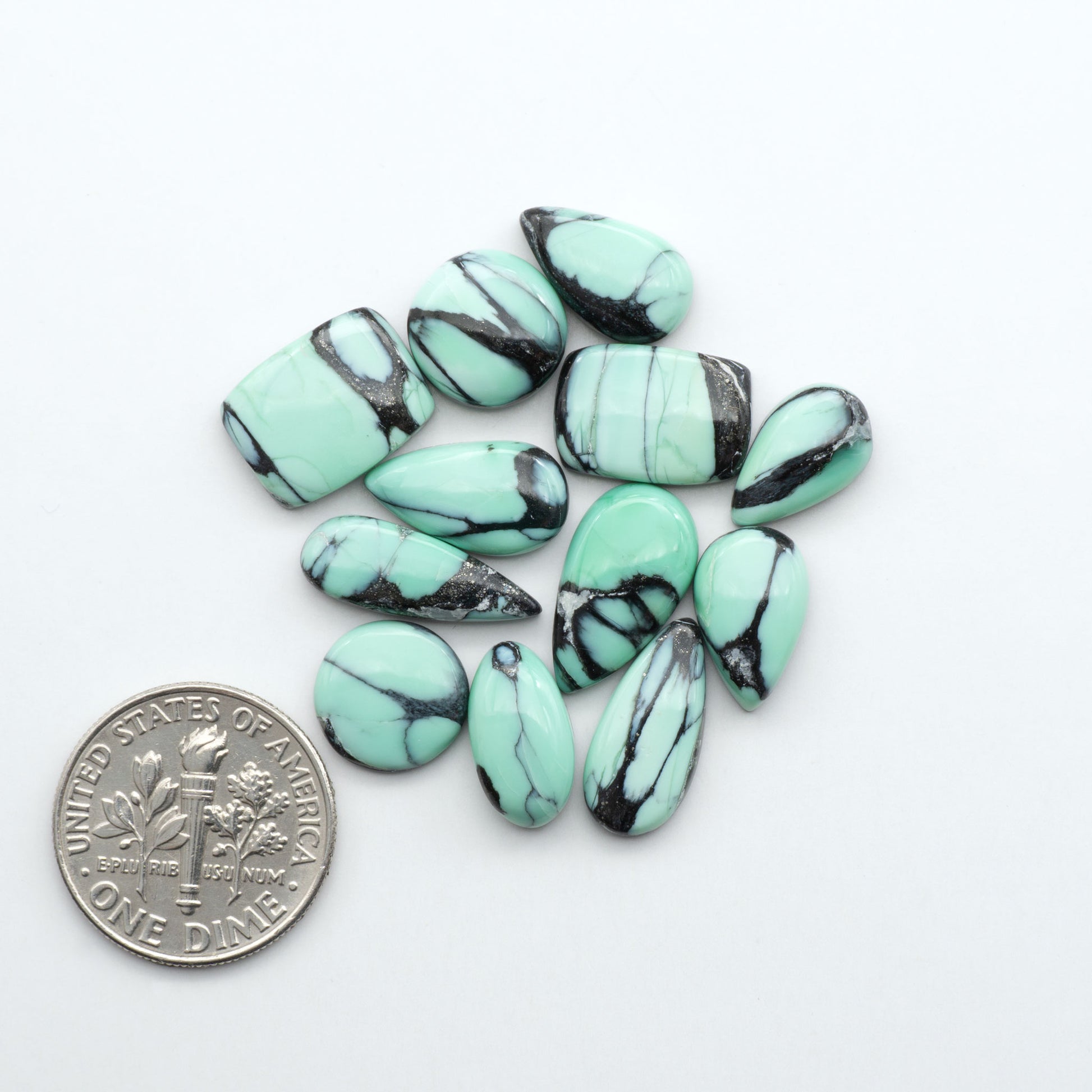 Shop Variscite cabochons with natural matrix patterns, ideal for silversmiths and jewelry makers creating custom rings and pendants.