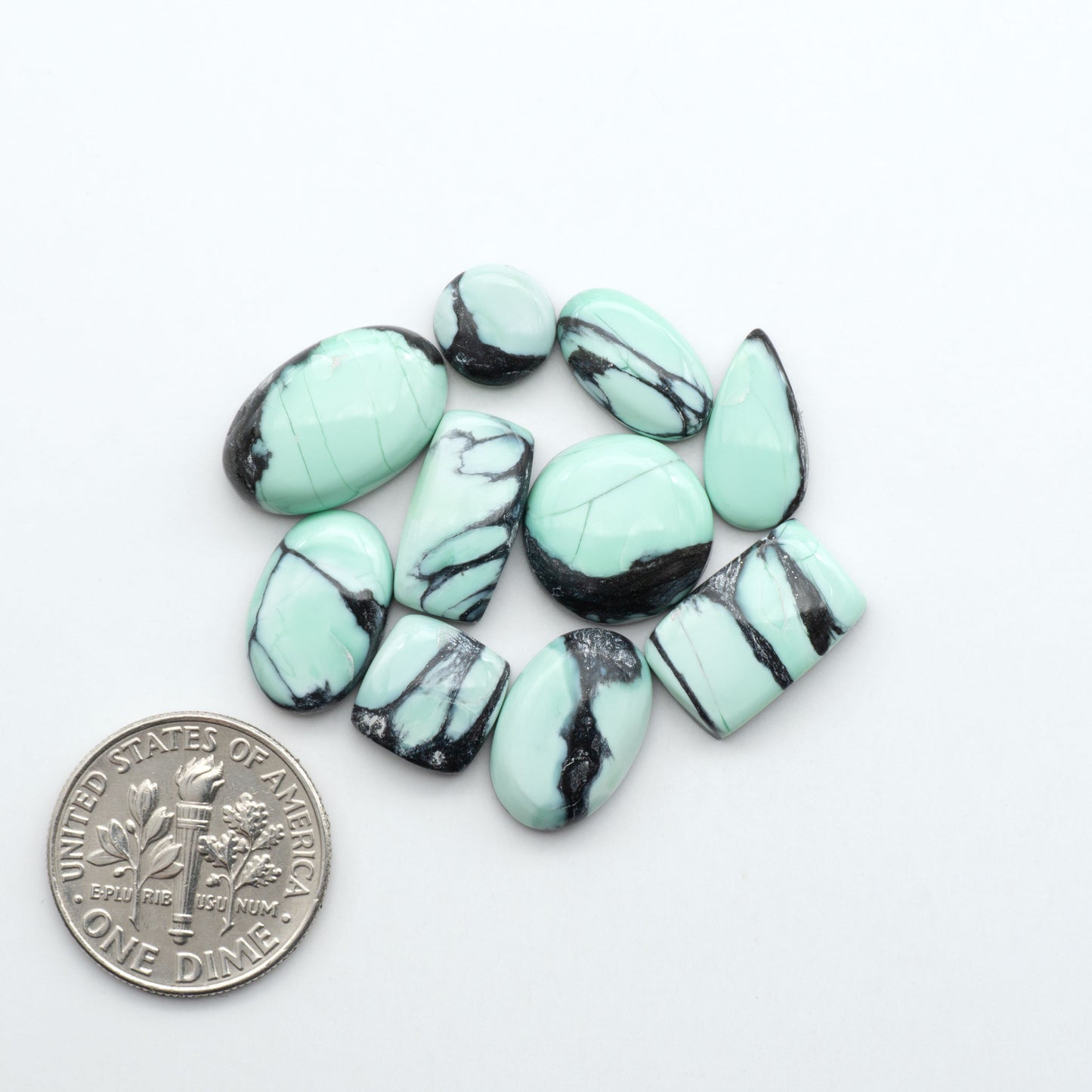 Shop Variscite cabochons with natural matrix patterns, ideal for silversmiths and jewelry makers creating custom rings and pendants.