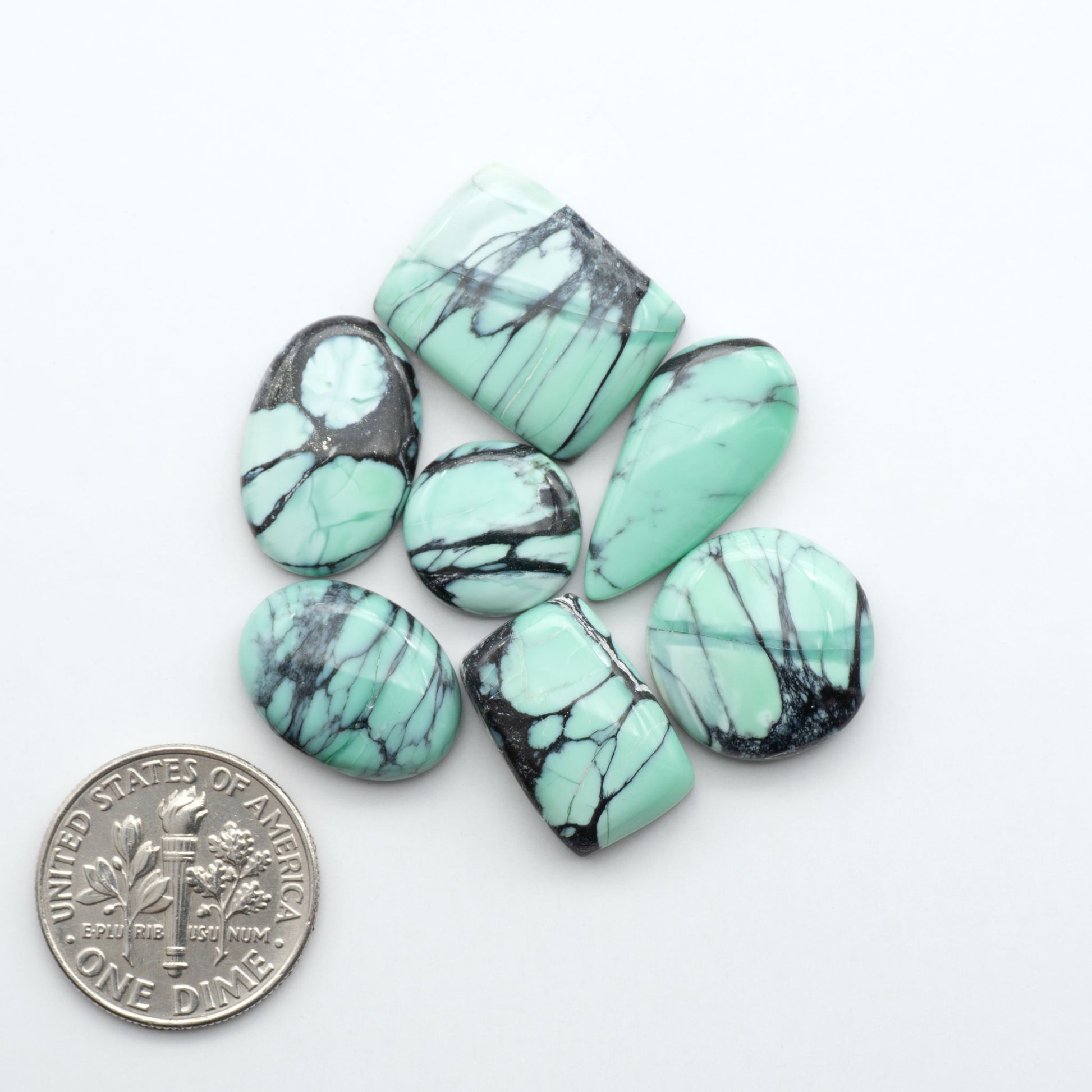 Shop Variscite cabochons with natural matrix patterns, ideal for silversmiths and jewelry makers creating custom rings and pendants.