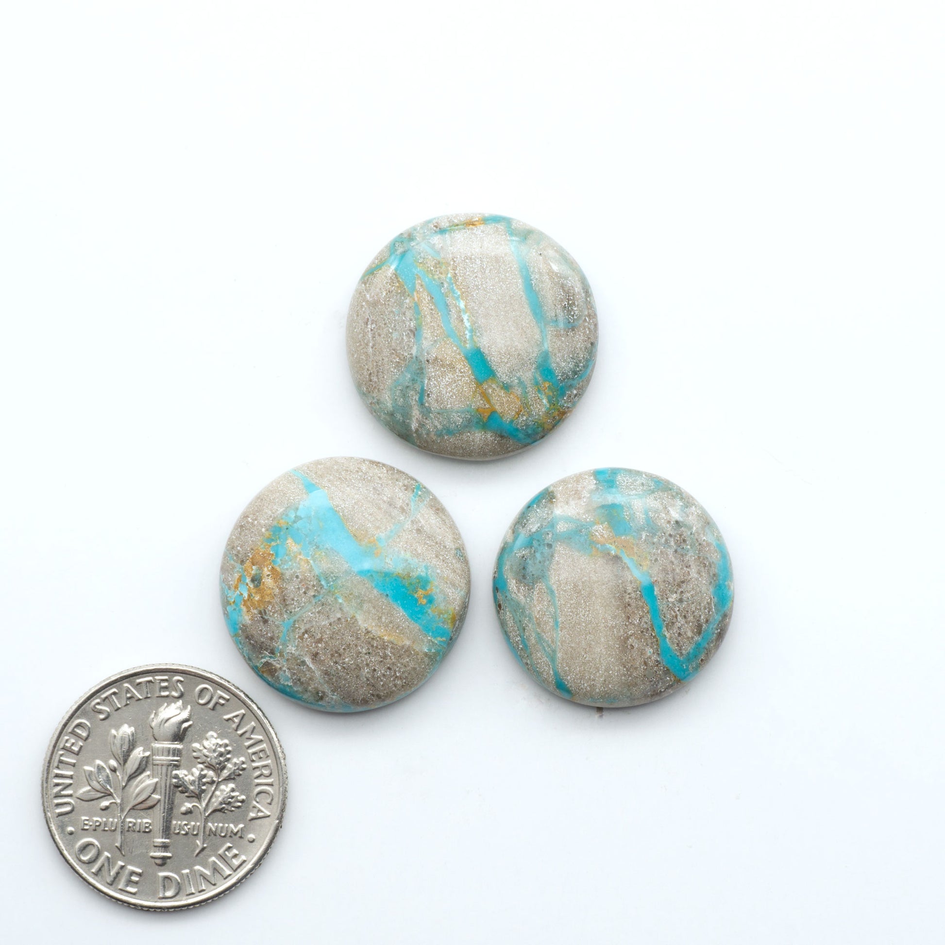 Carico Lake Turquoise cabochons with vibrant aqua-blue to turquoise tones and natural matrix, ideal for rings, pendants, and artisan jewelry.