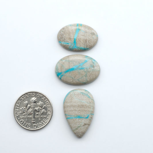 Carico Lake Turquoise cabochons with vibrant aqua-blue to turquoise tones and natural matrix, ideal for rings, pendants, and artisan jewelry.
