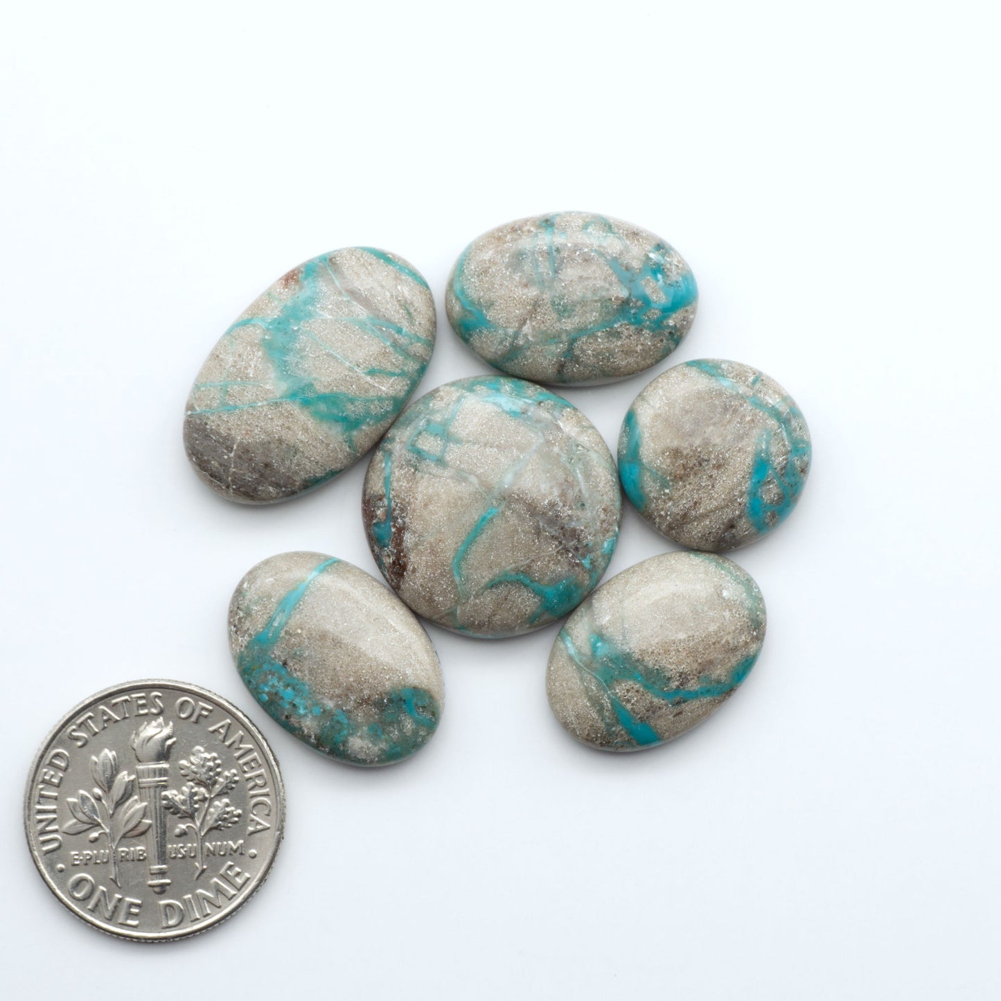 Carico Lake Turquoise cabochons with vibrant aqua-blue to turquoise tones and natural matrix, ideal for rings, pendants, and artisan jewelry.