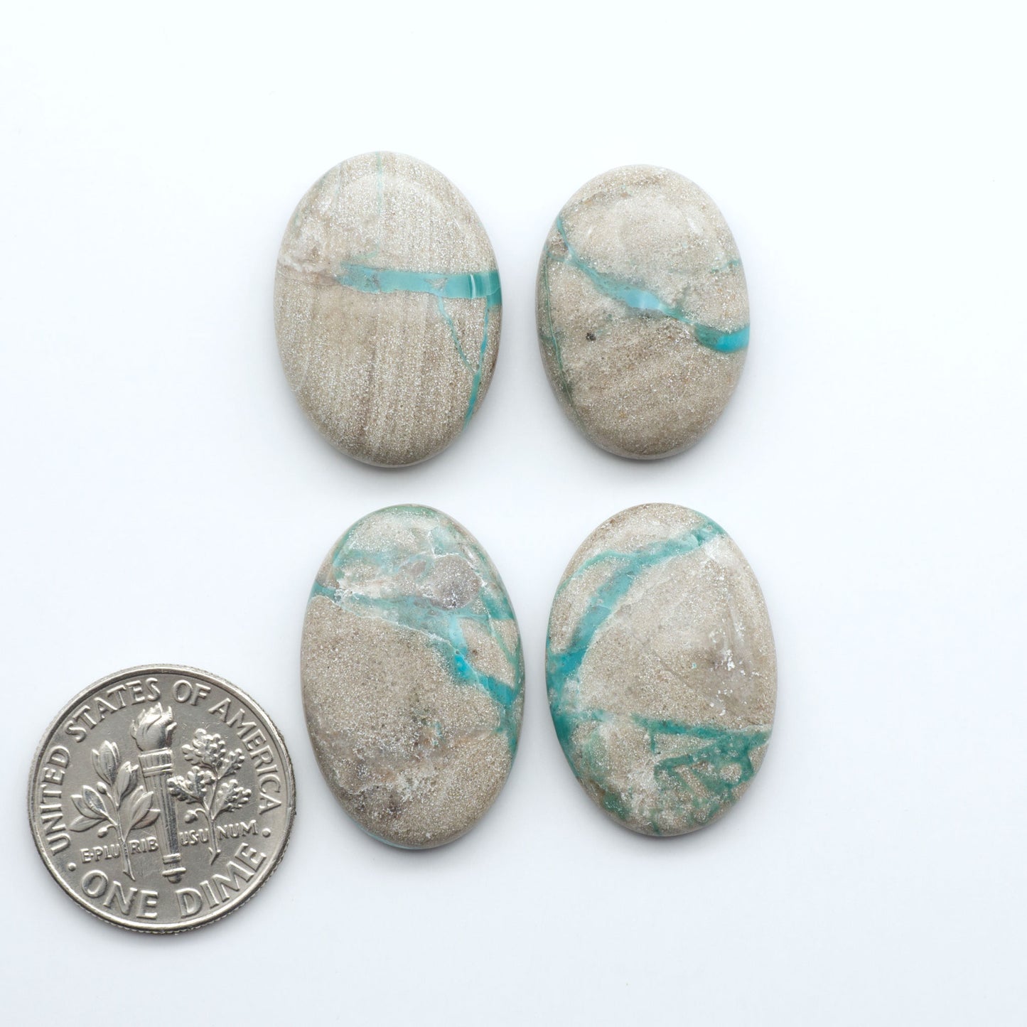 Carico Lake Turquoise cabochons with vibrant aqua-blue to turquoise tones and natural matrix, ideal for rings, pendants, and artisan jewelry.