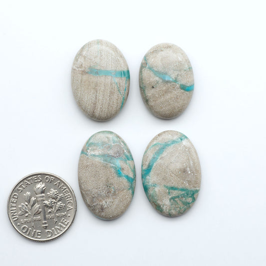 Carico Lake Turquoise cabochons with vibrant aqua-blue to turquoise tones and natural matrix, ideal for rings, pendants, and artisan jewelry.