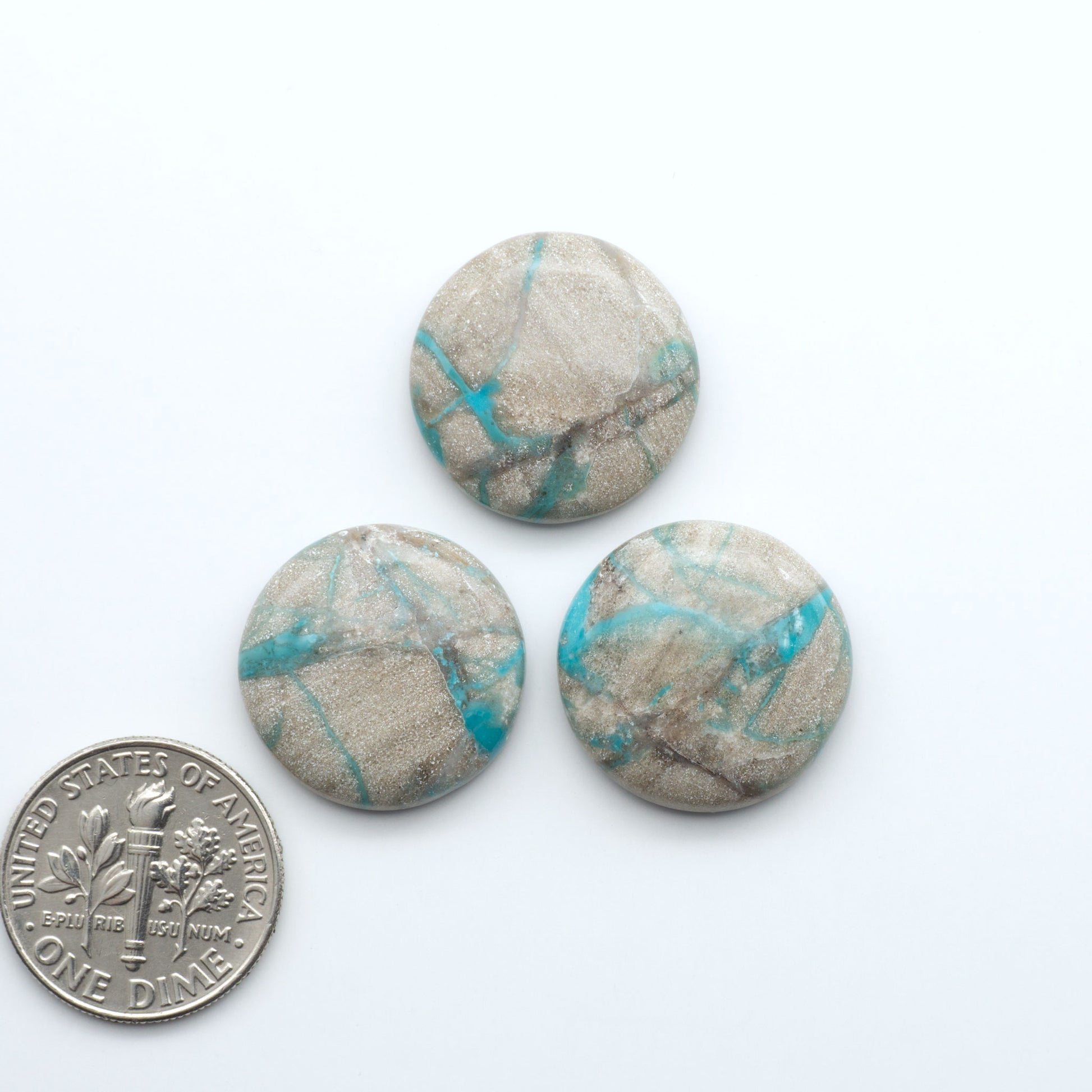 Carico Lake Turquoise cabochons with vibrant aqua-blue to turquoise tones and natural matrix, ideal for rings, pendants, and artisan jewelry.