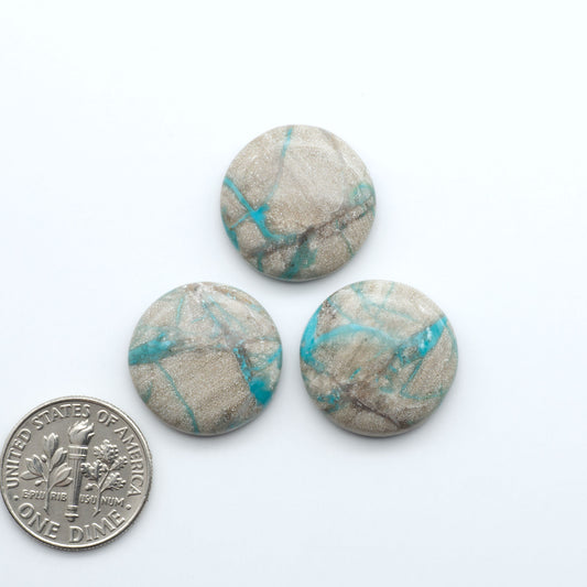 Carico Lake Turquoise cabochons with vibrant aqua-blue to turquoise tones and natural matrix, ideal for rings, pendants, and artisan jewelry.