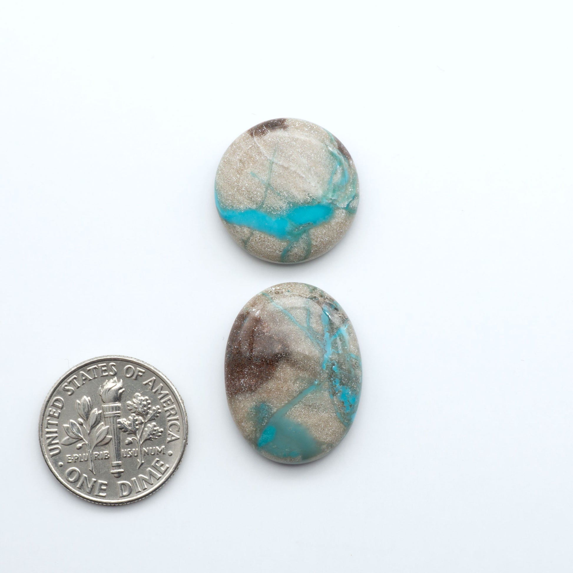Carico Lake Turquoise cabochons with vibrant aqua-blue to turquoise tones and natural matrix, ideal for rings, pendants, and artisan jewelry.