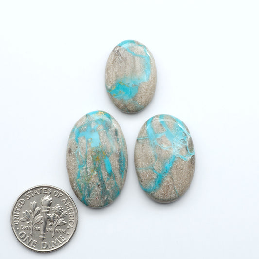 Carico Lake Turquoise cabochons with vibrant aqua-blue to turquoise tones and natural matrix, ideal for rings, pendants, and artisan jewelry.