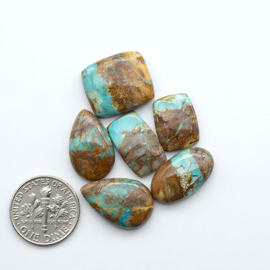 Royston Turquoise cabochons are famous for their distinctive matrix and unique green and blue hues, making them a favored option among jewelry designers.

