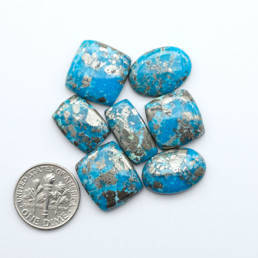 Nacozari turquoise cabochons are striking gemstones known for their vibrant blue to greenish-blue colors and pyrite, these stones are prized in jewelry making.