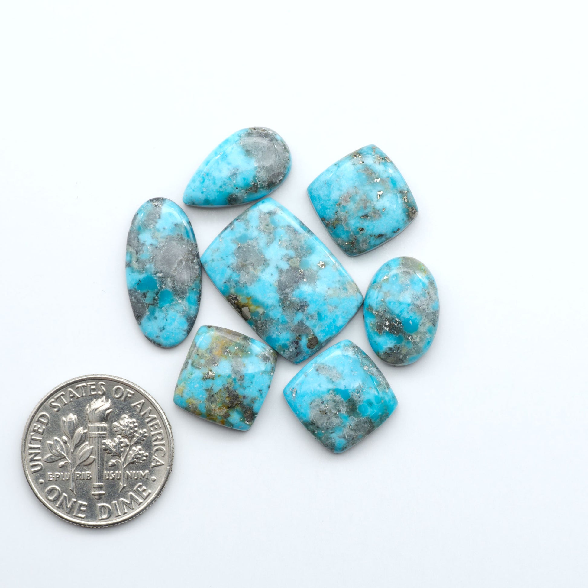 Nacozari turquoise cabochons are striking gemstones known for their vibrant blue to greenish-blue colors and pyrite, these stones are prized in jewelry making.