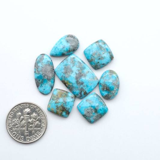 Nacozari turquoise cabochons are striking gemstones known for their vibrant blue to greenish-blue colors and pyrite, these stones are prized in jewelry making.